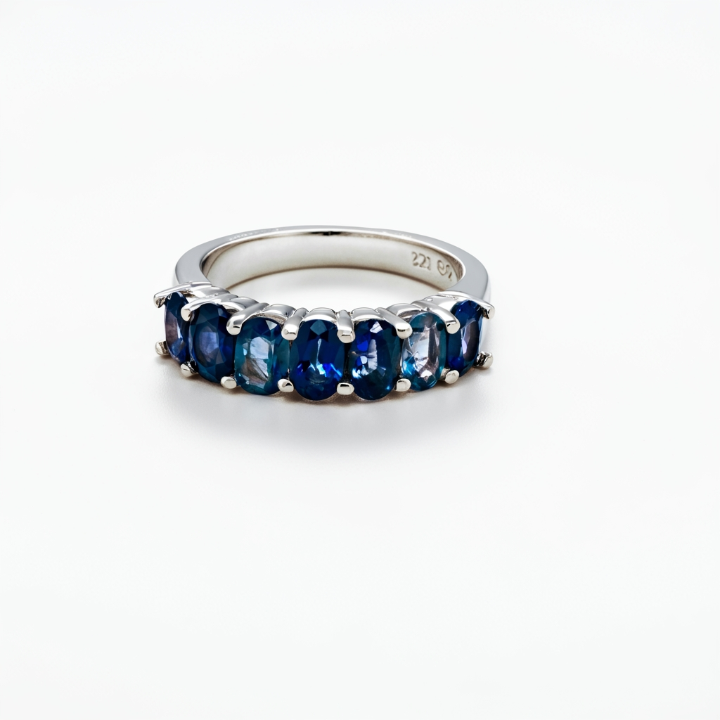 Oval blue sapphire 1/2 band